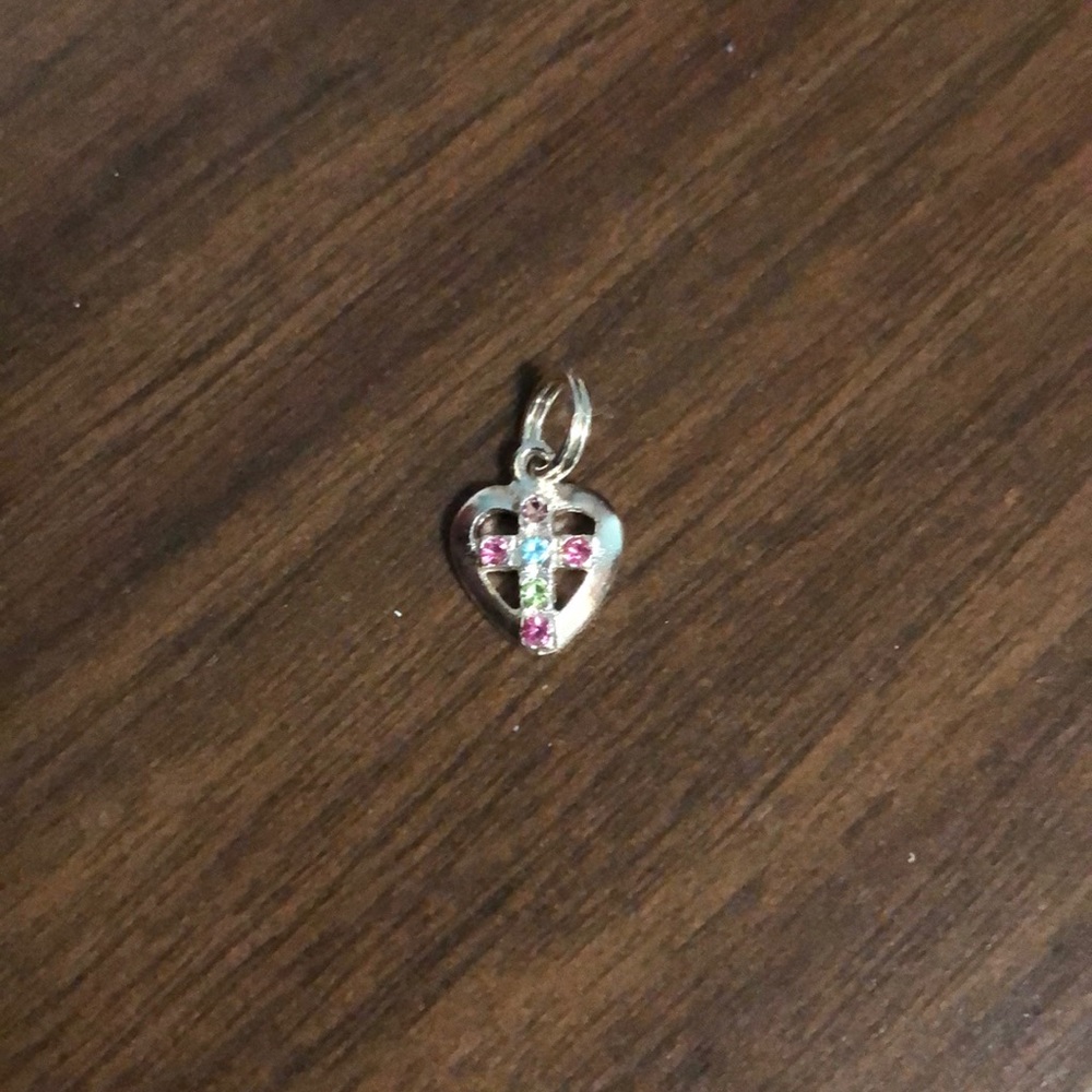Sterling silver cross inside heart charm